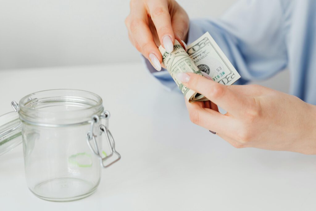 An image showing a lady saving money