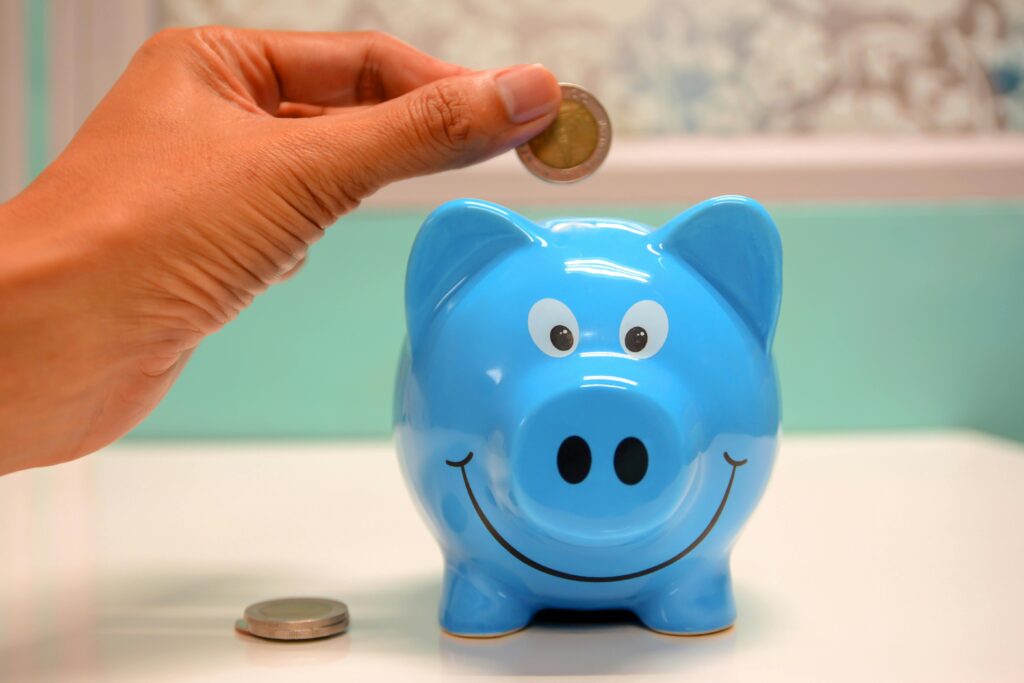 A image of a piggy bank with some coins